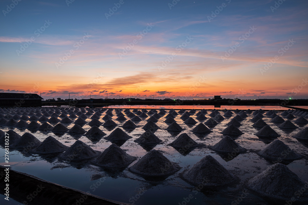 Beautiful landscape at sunset Agriculture  salt Farming. sea-salt production in the country, Sunset in Salt farming at Samut Sakhon Thailand.