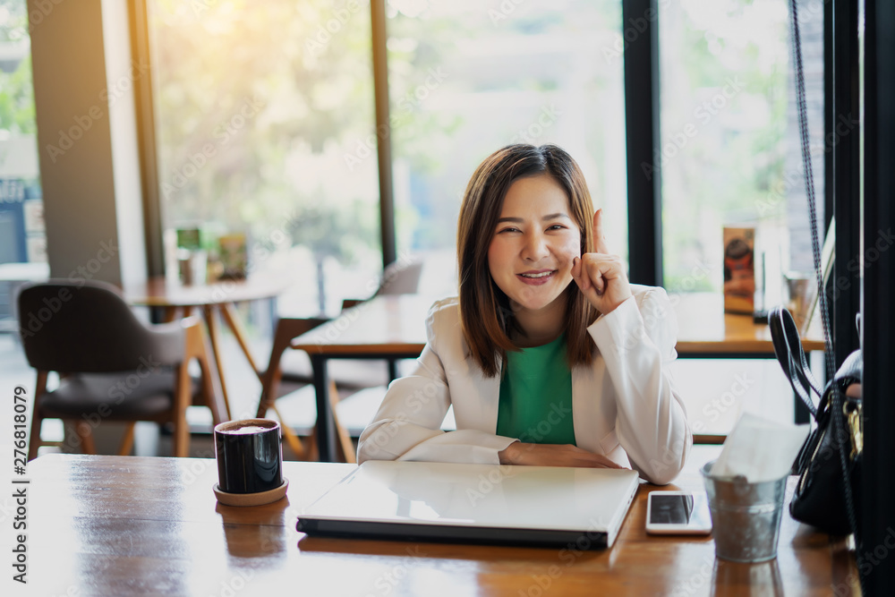 business woman working with use computer and smartphone in coffee shop. business relaxing and break time. freelance working and freedom work. business finance success. business woman working with use computer and smartphone in coffee shop. business relaxing and break time. freelance working and freedom work. business finance success.