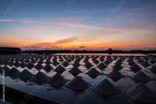 Beautiful landscape at sunset Agriculture salt Farming. sea-salt production in the country, Sunset in Salt farming at Samut Sakhon Thailand.