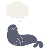 cute cartoon seal and thought bubble in retro style