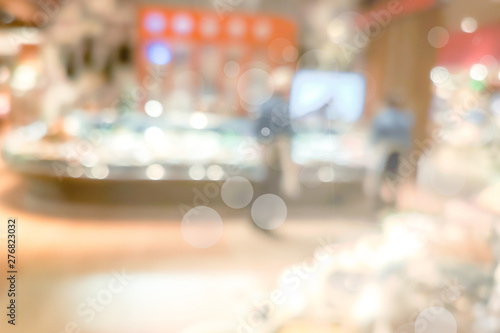 Blur Shopping mall background with bokeh light, golden color background © joeycheung