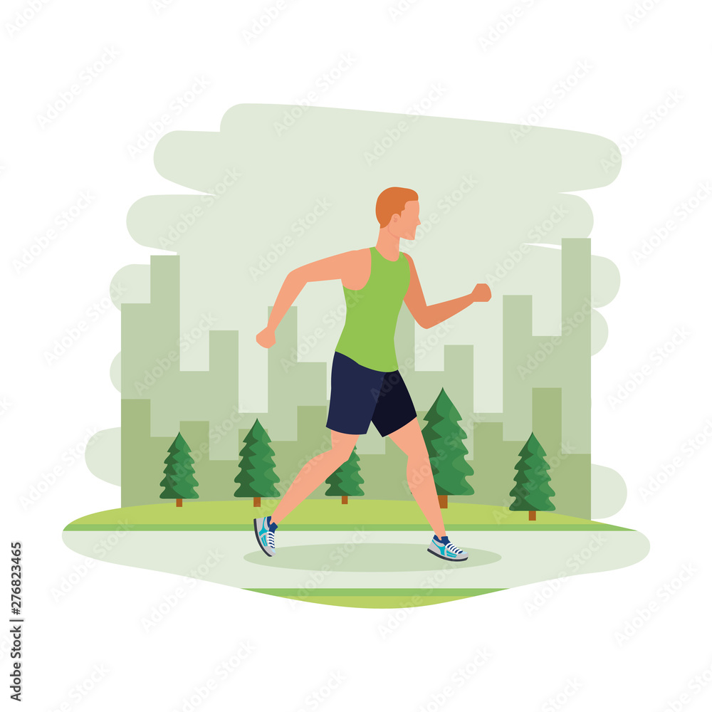 Fototapeta premium young athletic man running in the landscape