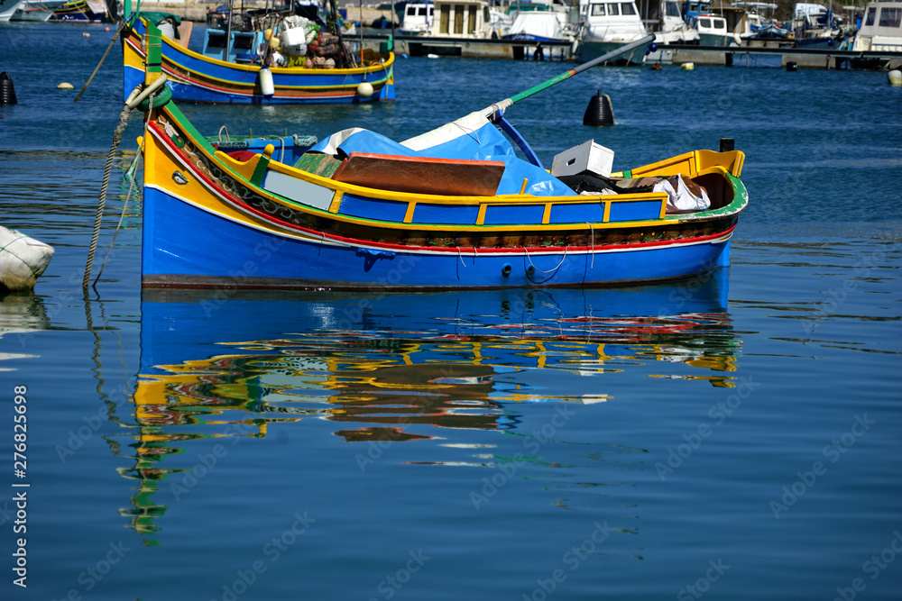 close up colorful traditional wooden fishing boats in harbor of Mediterranean island Malta