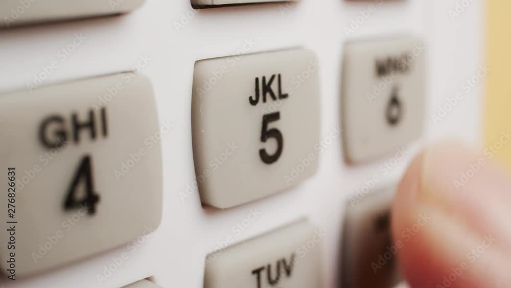 Macro shot of finger entering in a security code Macro shot of finger entering in a security code