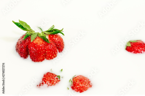 Fototapeta Naklejka Na Ścianę i Meble -  Red natural ripe strawberries in milk cream
