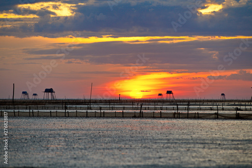 Sunrise over clam farms on Dong Chau beach, Thai Binh, Vietnam © hcongthanh