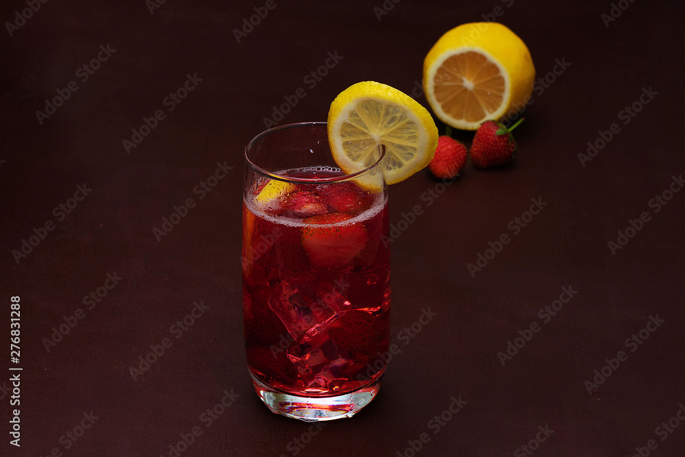 Drink with ice from strawberries on a dark background. Fresh strawberry cocktail. Fresh summer cocktail with strawberry and ice cubes. Glass of strawberry soda drink on dark background. Drink with ice from strawberries on a dark background. Fresh strawberry cocktail. Fresh summer cocktail with strawberry and ice cubes. Glass of strawberry soda drink on dark background.