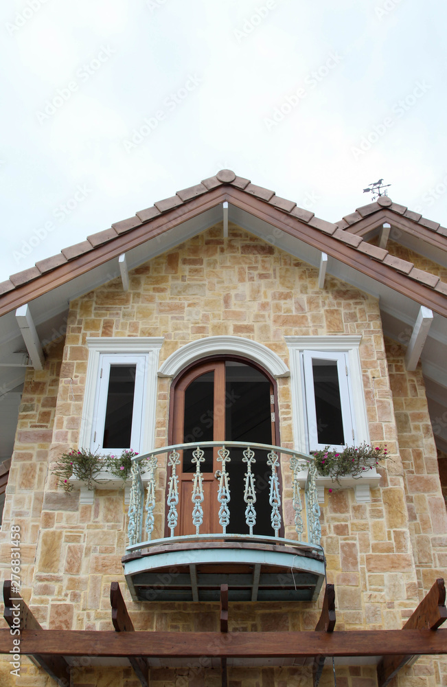 Fototapeta premium Decorative window and balcony on the second floor.