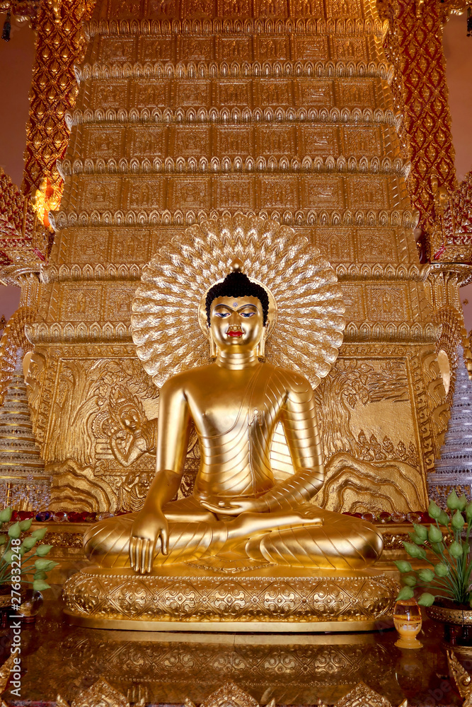 gold buddha statue sit action on another bhudda on asian art background