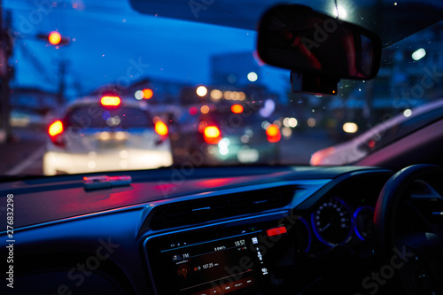 Defocused Image Of Traffic On City Street At Night, view from inside car. 