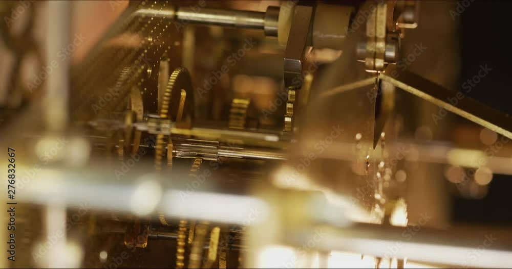 Inside macro shot of a working clock mechanism as it keeps time. Codec ...