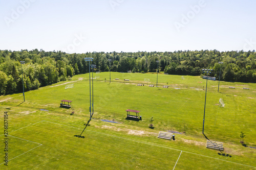 Aerial/Drone view of soccer/football field complex during the afternoon in Ontario, Canada.