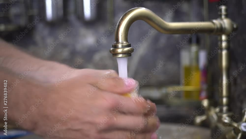 Man thoroughly wash the lemon Man thoroughly wash the lemon