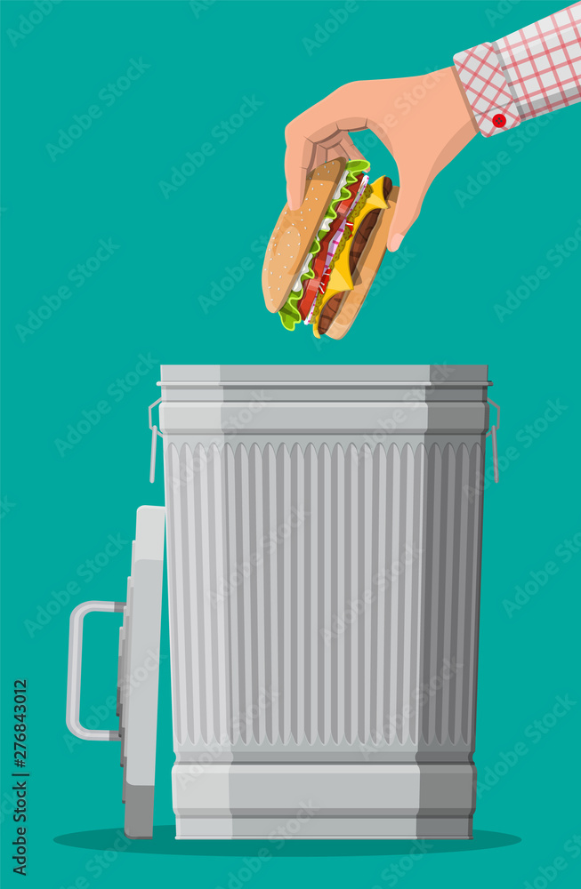 Hand throwing away burger to trash bin. Prohibited cheeseburger, banned unhealthy fastfood