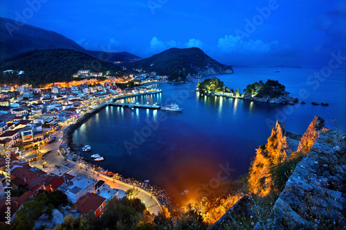 Panoramic night view of Parga town and the islet of Panagia from the Venetian castle of the town, Preveza prefecture, Epirus, Greece