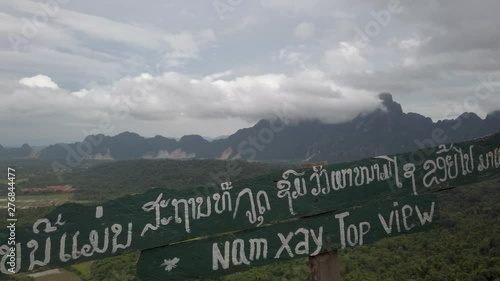 Amazing cloudy laos landscape panoramic view point, Vang Vieng. land field and mountains epic view photo