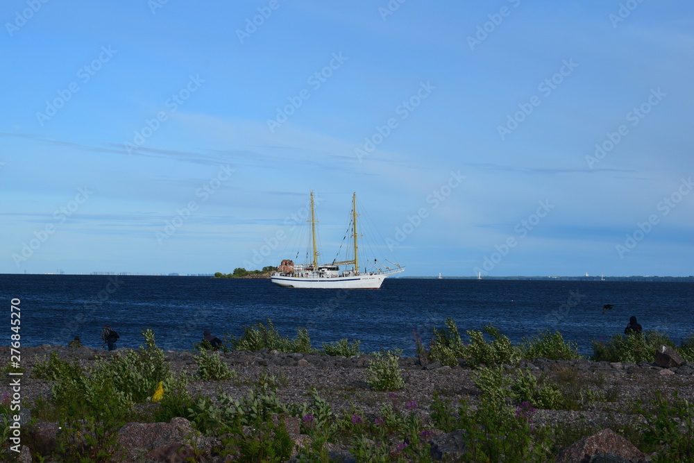 sailboat in the sea against the blue sky