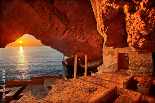 Sunset at the cave of the church of Agios Stefanos, close to Galissas village, Syros island, Cyclades, Aegean sea, Greece  photo