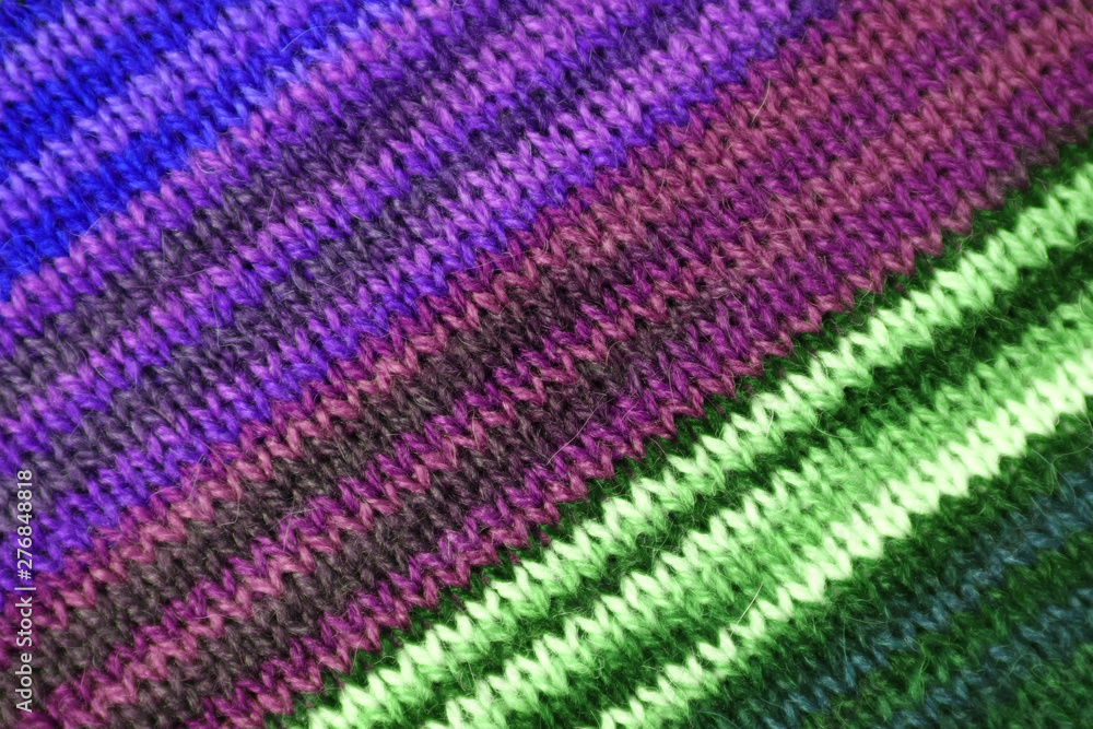 Texture of the Diagonal Stripe Patterns of Purple and Green Color Toned Alpaca Knitted Wool Fabric Texture of the Diagonal Stripe Patterns of Purple and Green Color Toned Alpaca Knitted Wool Fabric