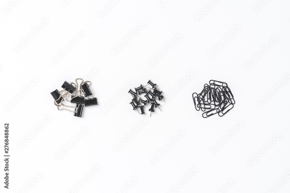 Various kinds of black paperclips and drawing pins Various kinds of black paperclips and drawing pins
