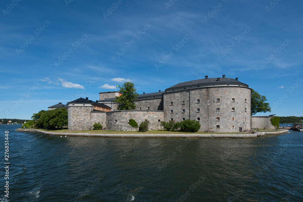 The pier and fortress at the town Vaxholm in Stockholm archhipelago a summer day