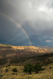 Double rainbow over valley and cliffs near Zion