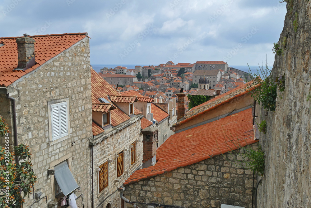 Panoramic view from Dubrovnik City Walls, old historic stone houses, Croatia
