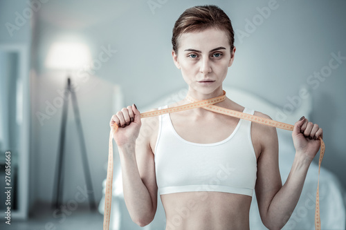 Concentrated brunette girl looking straight at camera photo