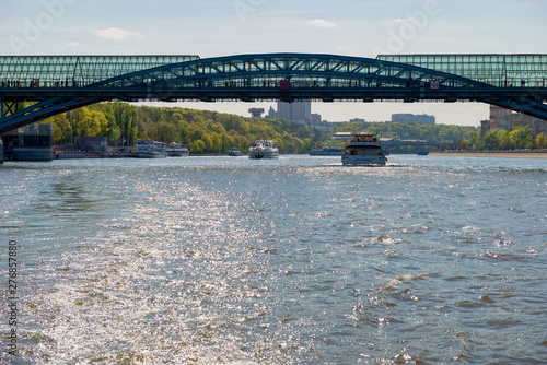 Moscow, Russia - May 6, 2019: View of the Andreevsky bridge over the Moscow River and tourist pleasure craft on a summer day photo