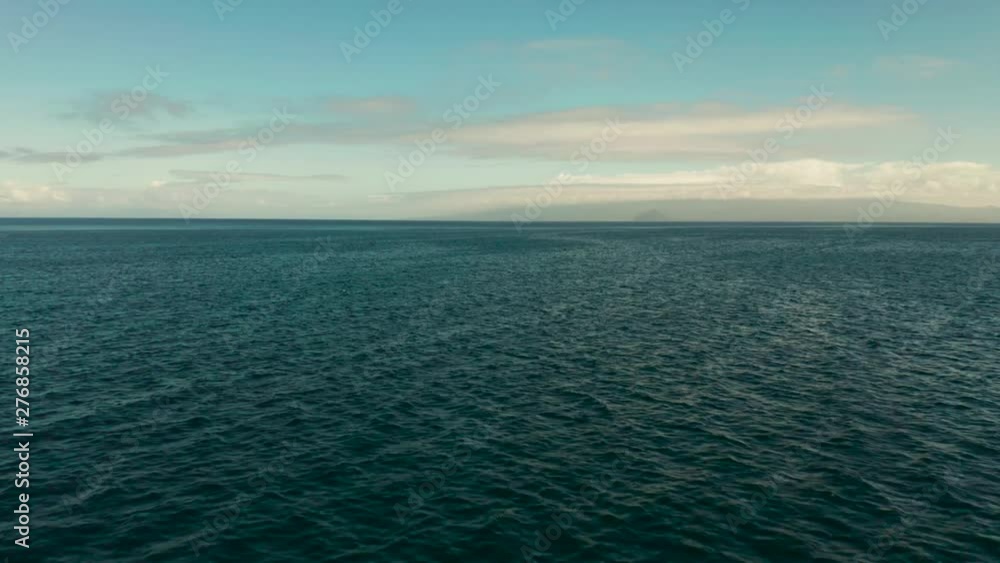 custom made wallpaper toronto digitalSea surface with waves against the blue sky with clouds, aerial view. Blue sea water with small waves against sky.