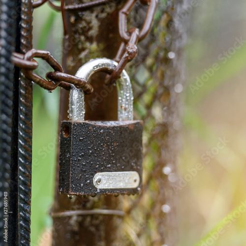 Padlock on the chain - the concept of protection