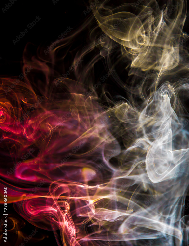 Obraz premium Colored smoke on black background