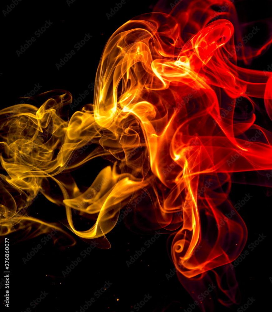 Fototapeta premium Colored smoke on black background