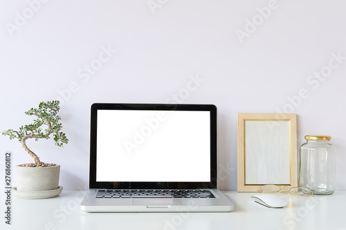 Workspace desk and mockup laptop. copy space and blank screen. Business image, Blank screen laptop and supplies. © wattana