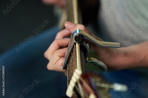 musician plays the guitar. view from the stage. closeup