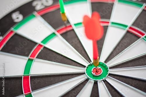 Dart hits Bullseye is a target and goal of business marketing as concept.
