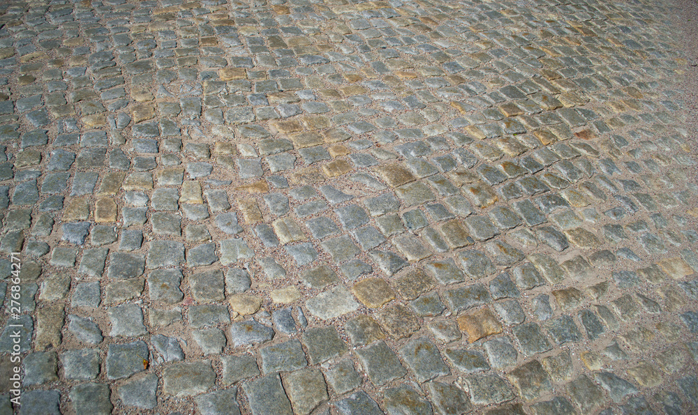 Texture of an old paving stone road from European countryside Texture of an old paving stone road from European countryside