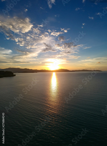 Aerial of epic Sunset and silhouettes of boats from Paliton Beach  Siquijor  Cebu  Philippines