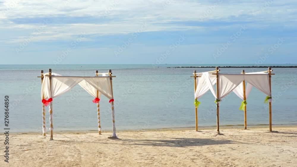 Ko Samui island beach with temporary shelters on a calm day, wide shot Ko Samui island beach with temporary shelters on a calm day, wide shot