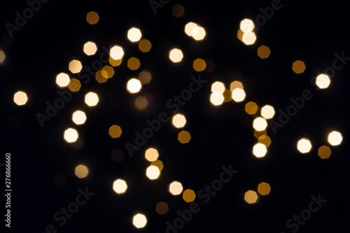 Abstract festive background with hexagon golden lights. Holiday concept