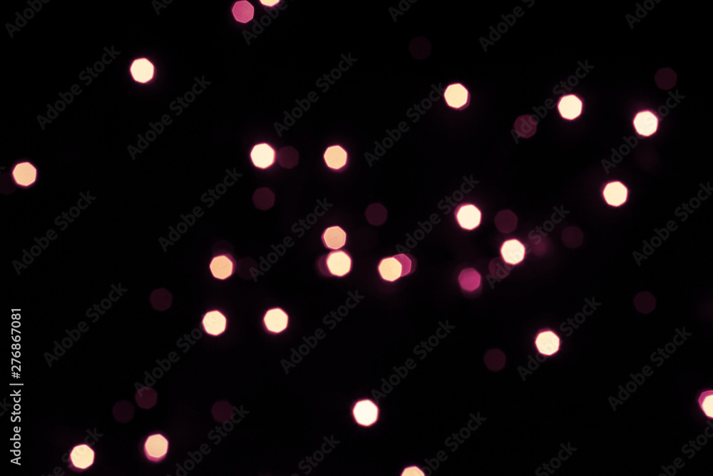 Black festive background with shining hexagonal bokeh lights Black festive background with shining hexagonal bokeh lights