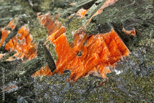 Macro stone mineral Diopside Calcite Magnetite on a white background photo