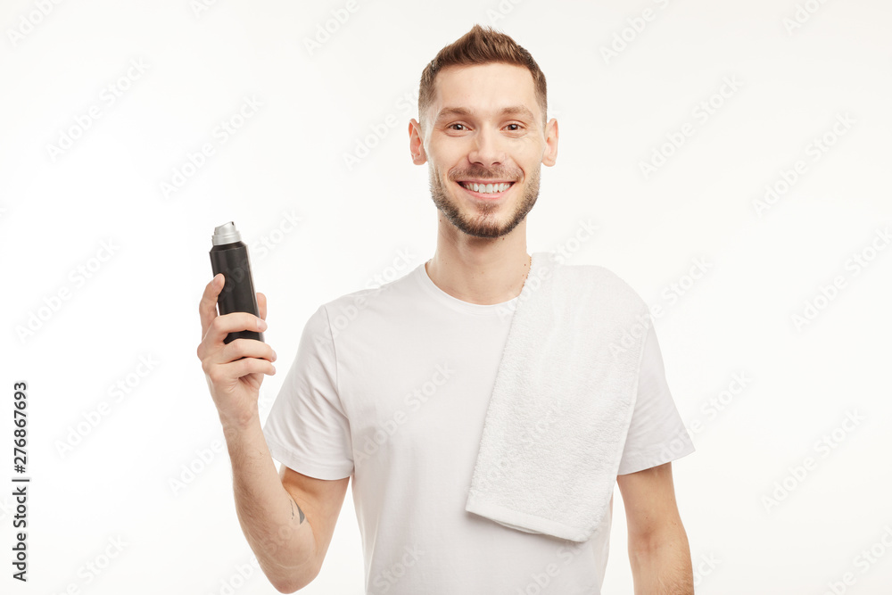 Smiling man wearing perfume on white background Smiling man wearing perfume on white background