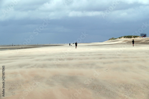 People go jogging on the beach during a hurricane like storm in Koksijde, Belgium