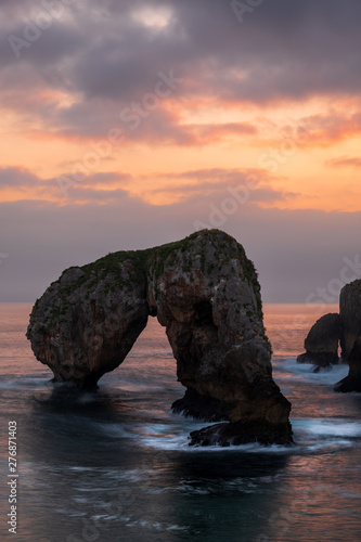 Bizarre rock of Castro de la gaviotas or Elephant Rock at sunset, Asturias Northern Spain
