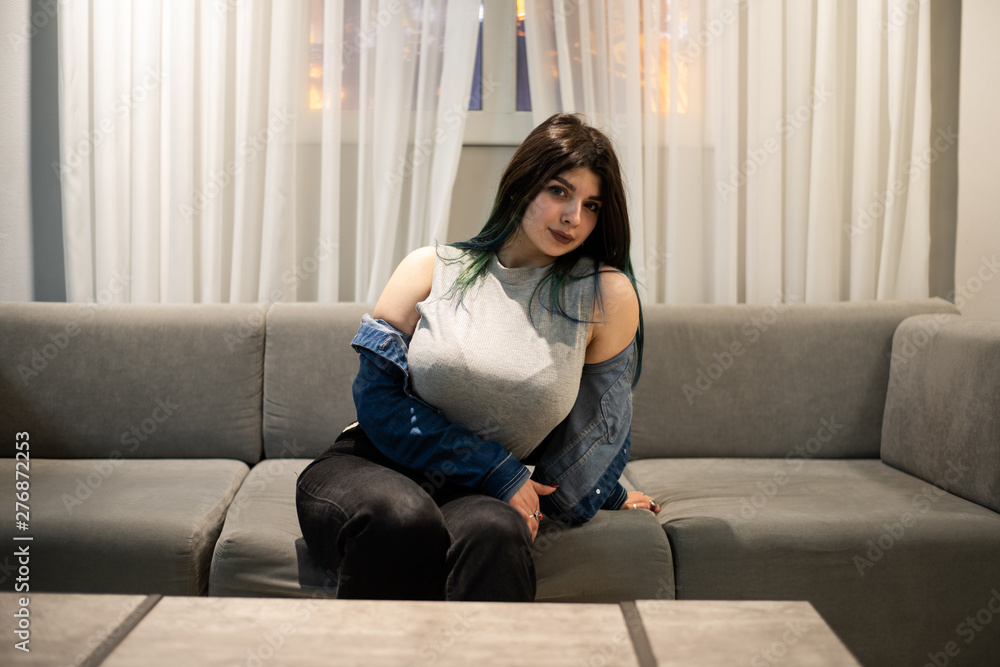 Obraz premium Young caucasian girl posing in a modern house