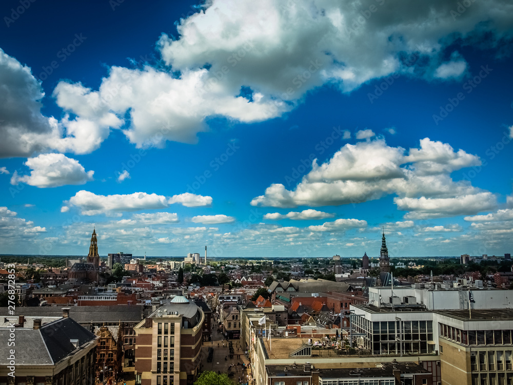 View over historic part of Groningen city under blue sky with clouds
