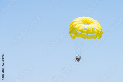 People on parasailing in the sky
