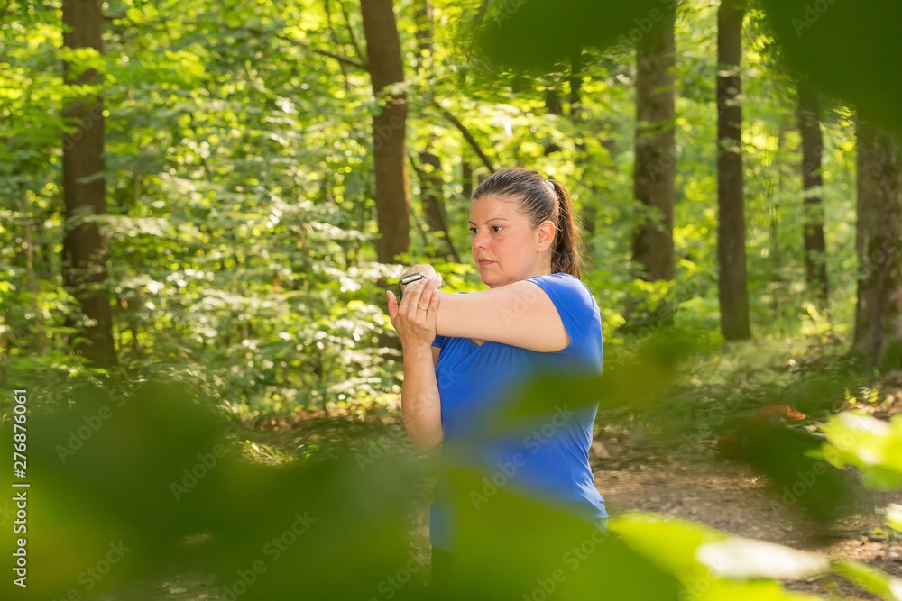 Lady stretches as part of her exercise routine