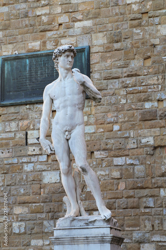 FLORENCE, ITALY - AUGUST 27, 2018: Copy of Michelangelo David statue in Florence with shadow its, Piazza della Signoria, Florence.